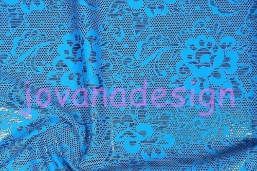 Black Print Foil on Turquoise Lycra.webp